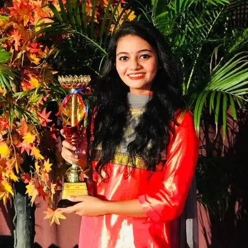Rupam with her award in a College fest
