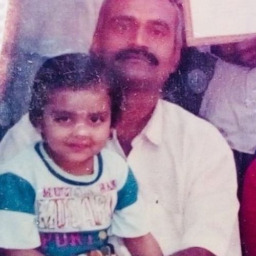 Childhood image of Anjali with her father